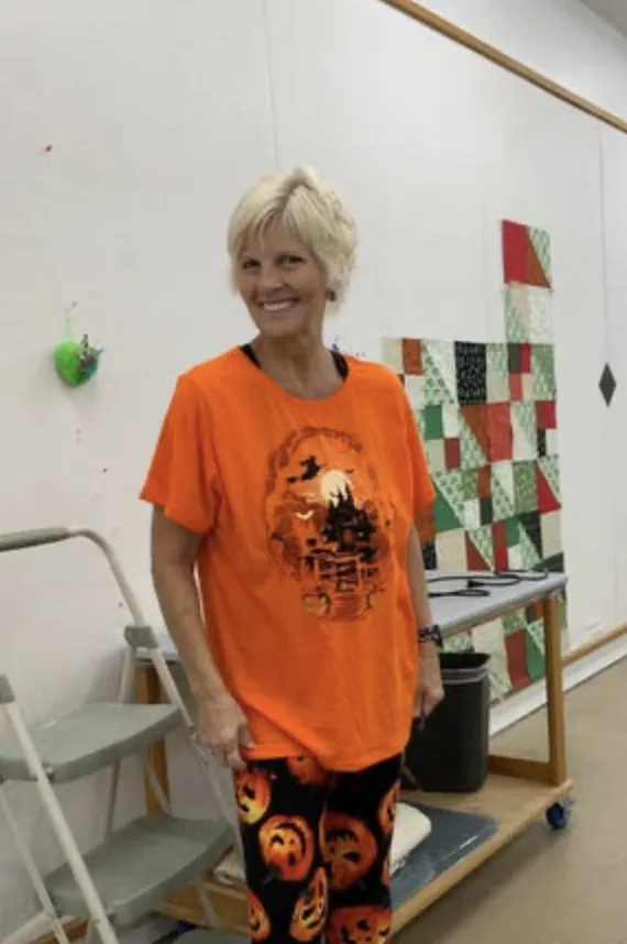 Guest smiling in the Compass Centre workroom