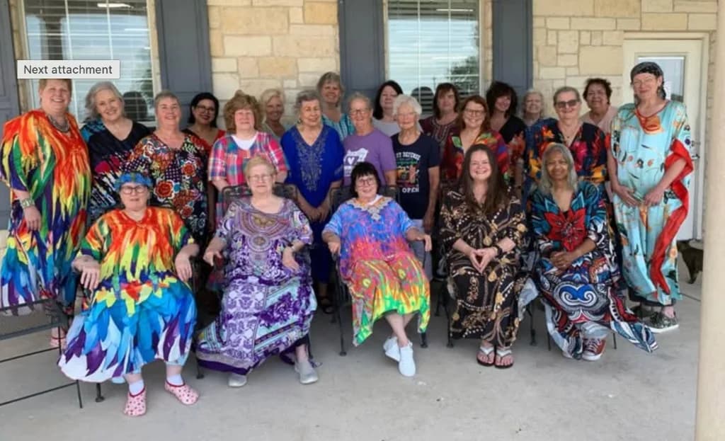 Retreat group in colorful kaftans on the porch