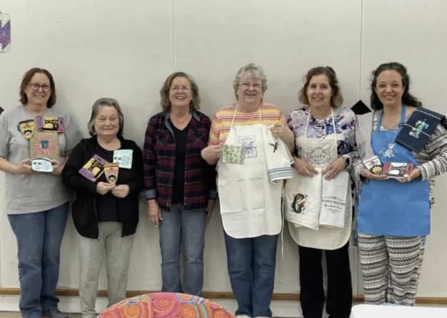 Guests showing embroidery and sewing projects