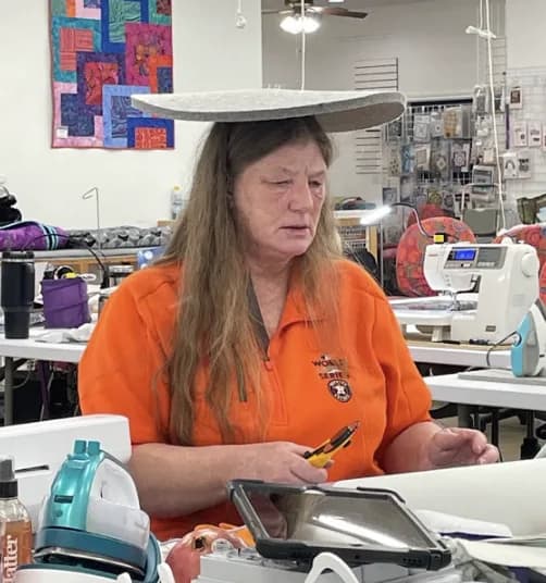 Guest at her station with a pressing mat