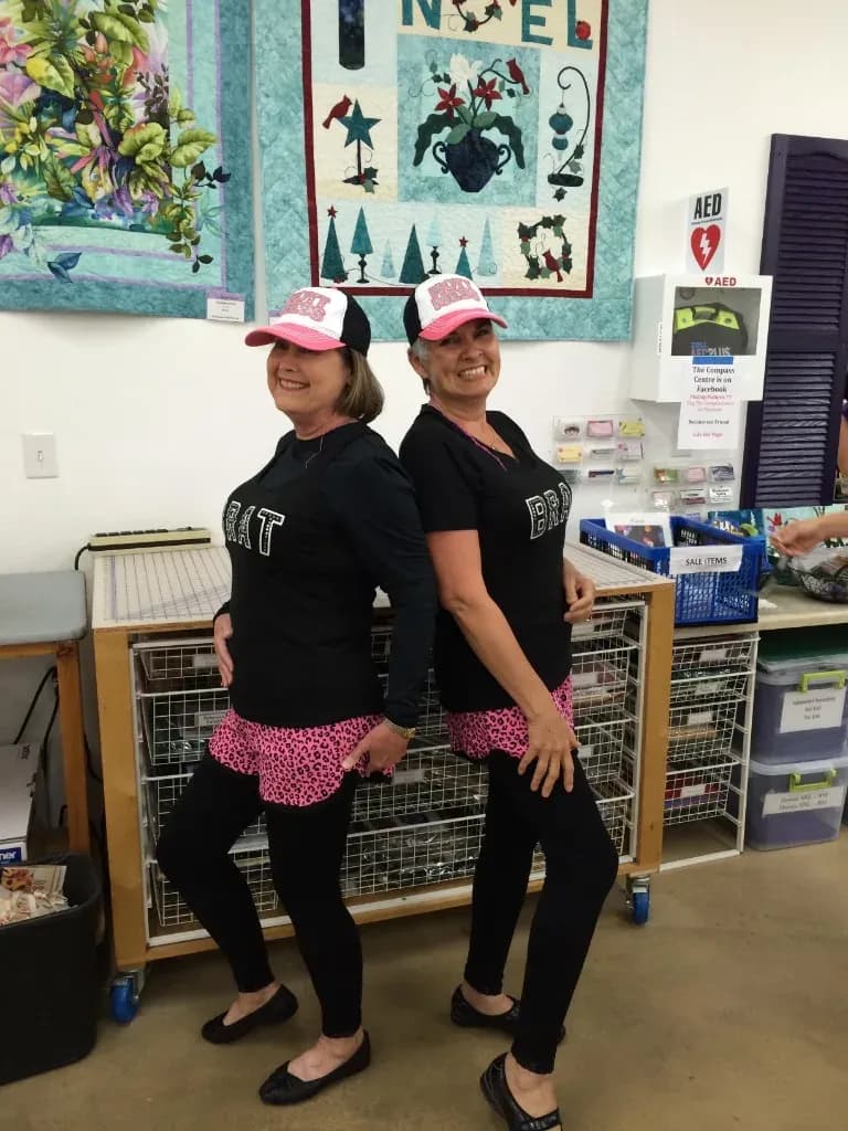 Two guests in matching Hot Mess outfits
