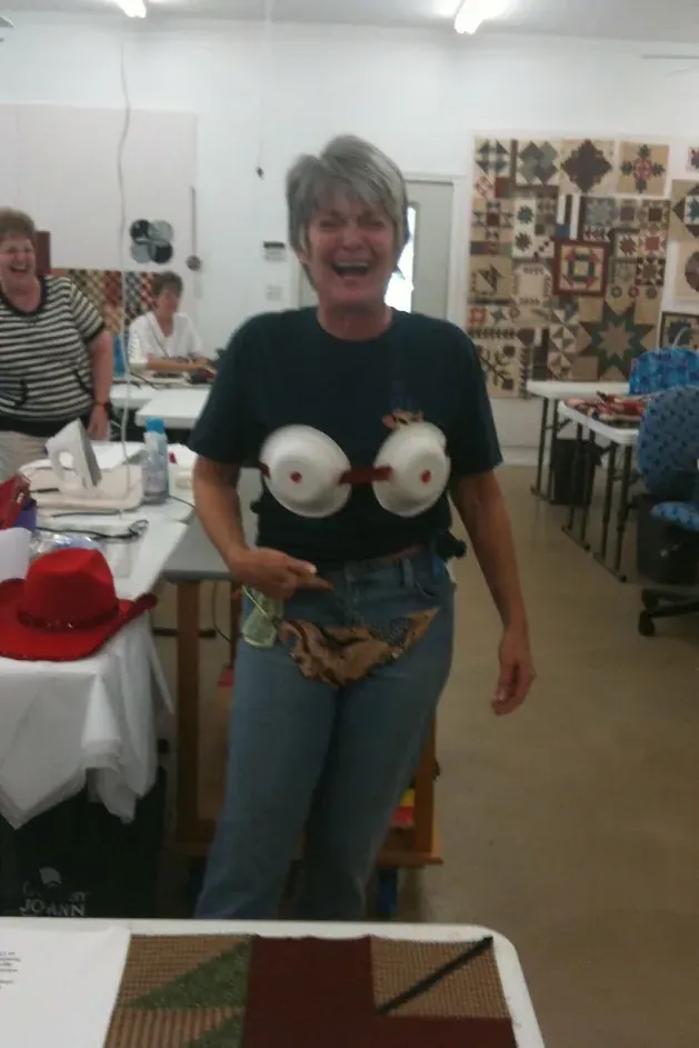 Guest enjoying a lighthearted moment in the workroom