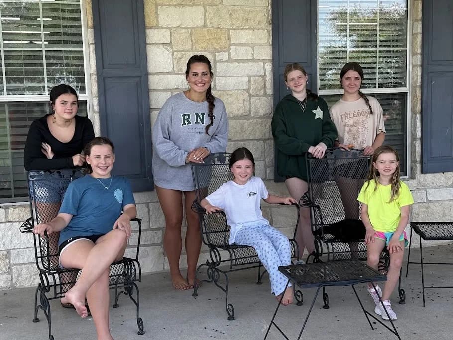 Buddy Retreat attendees posing together on the Centre porch